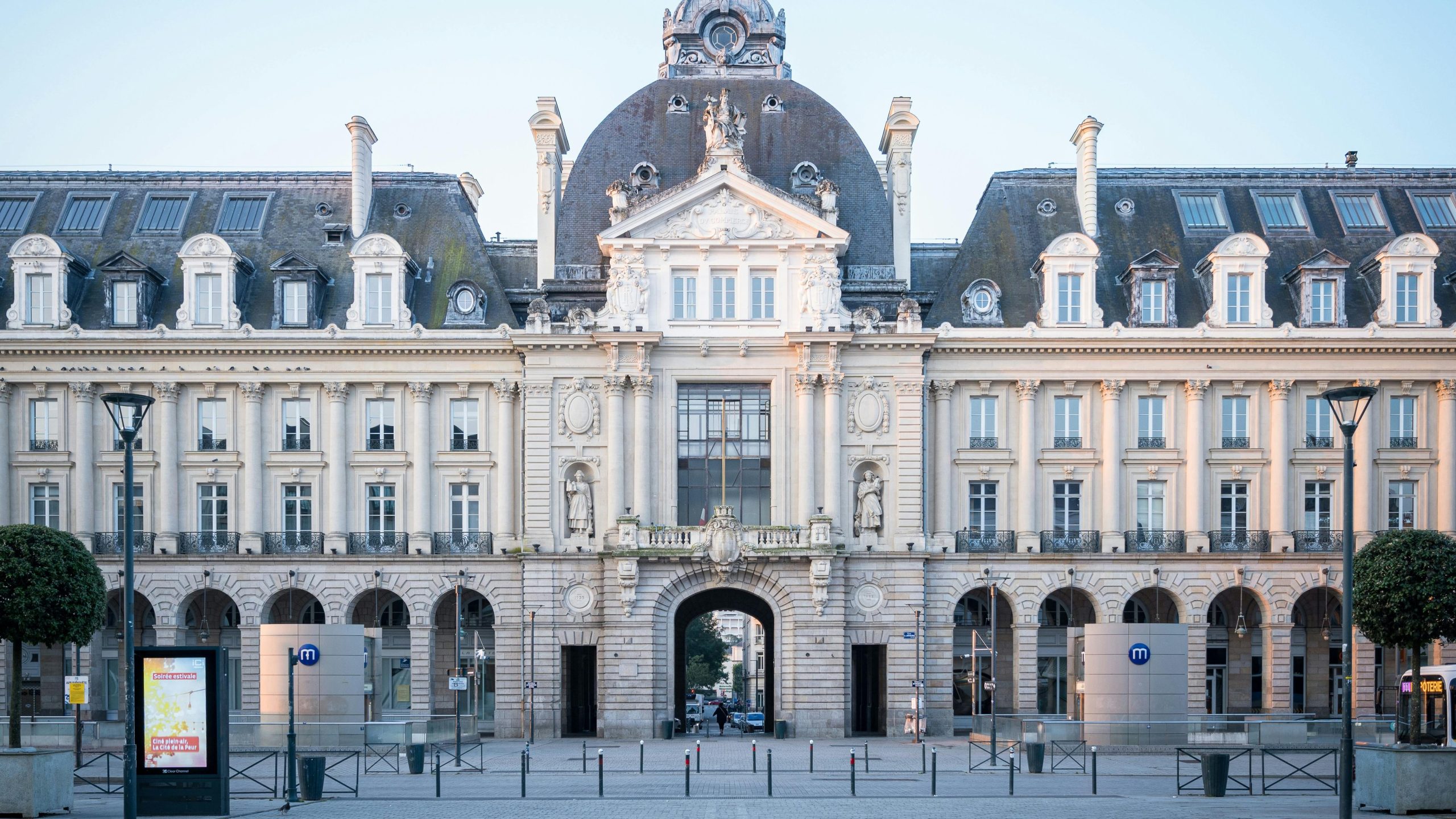 Stunning view of the Rennes City Hall with its classic baroque architecture under a clear blue sky.